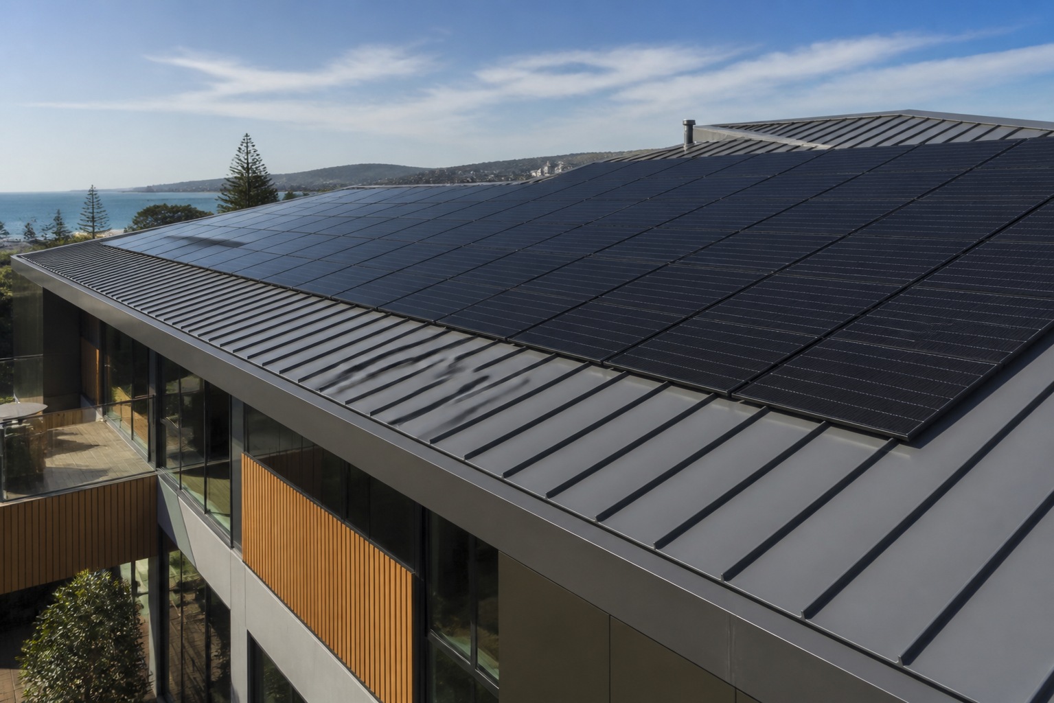 Aligned photovoltaic modules on a contemporary standing-seam roof